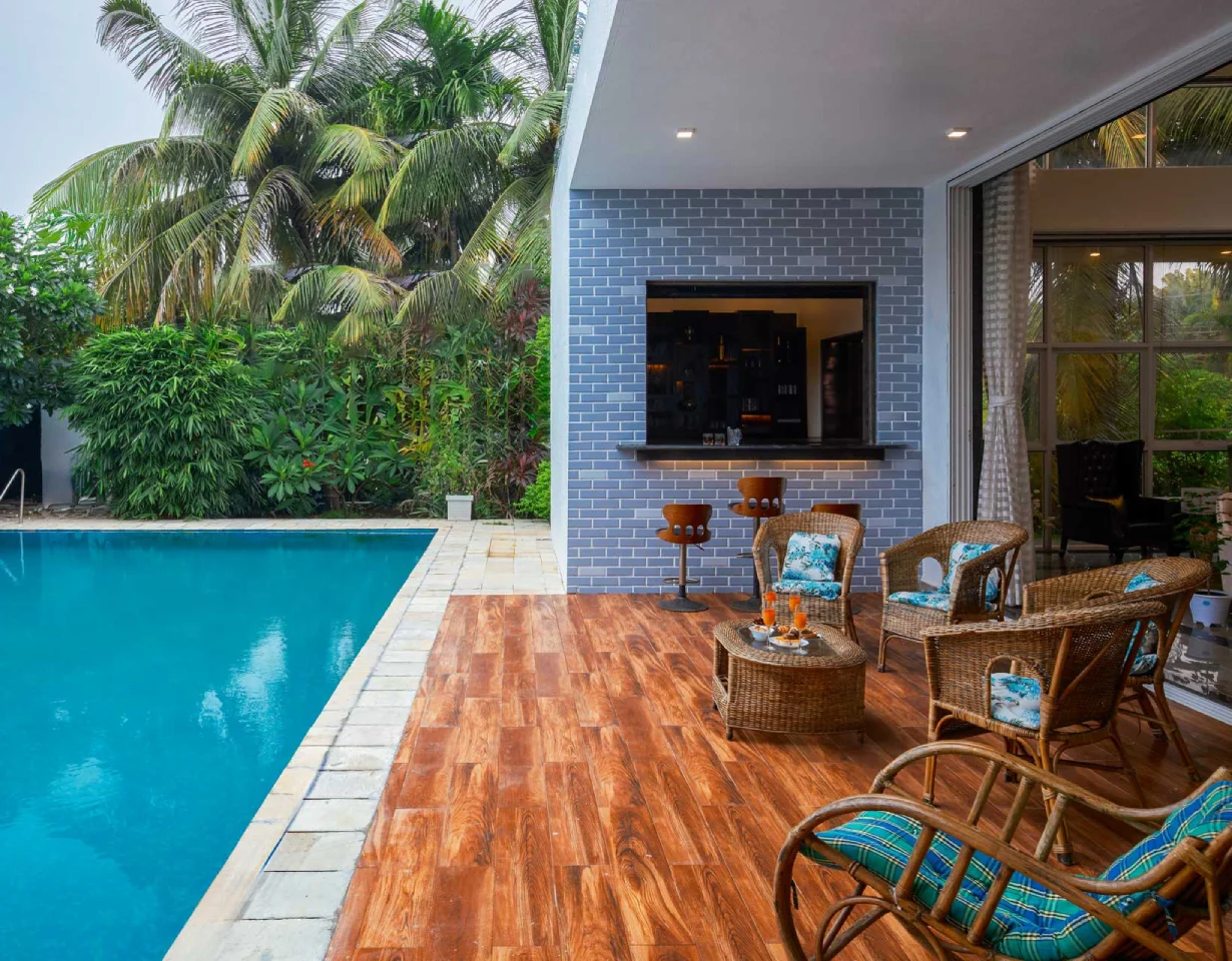 a pool with chairs and a table